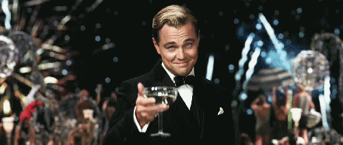 smiling leonardo dicaprio fireworks happy new year cheers GIF