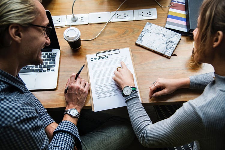 2-people-reviewing-a-contract
