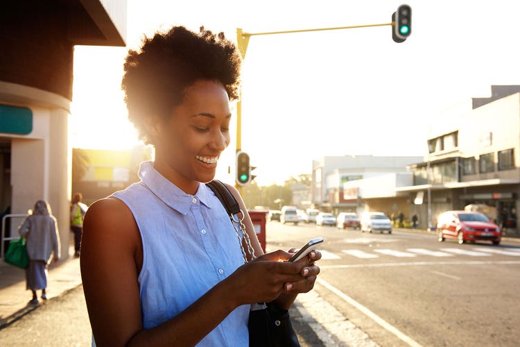 3-happy-woman-looking-at-phone