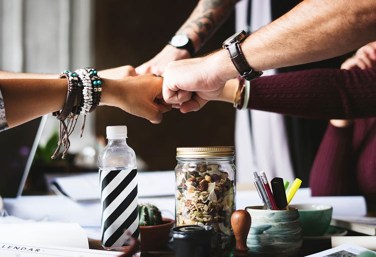 1-group-fistbump