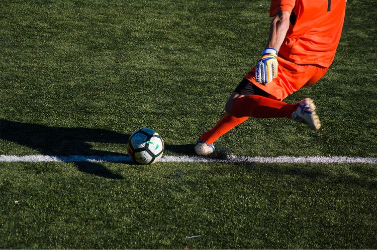 Action shot of soccer player about to kick the ball