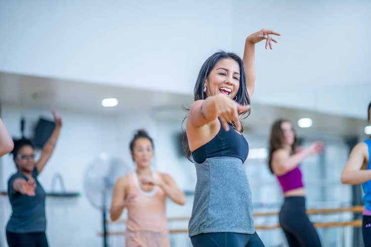 women dancing in a group fitness class