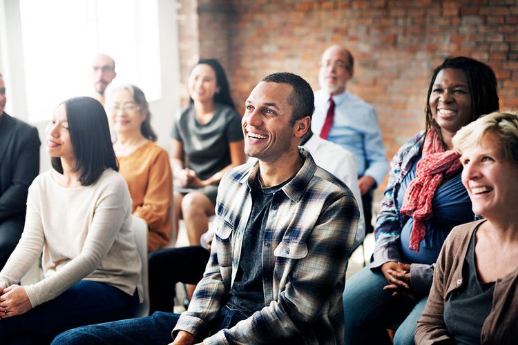 2-grpouop-of-people-listening-and-laughing