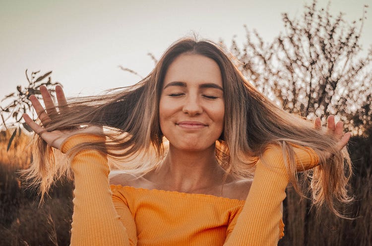 5-happy-woman-playing-with-her-hair