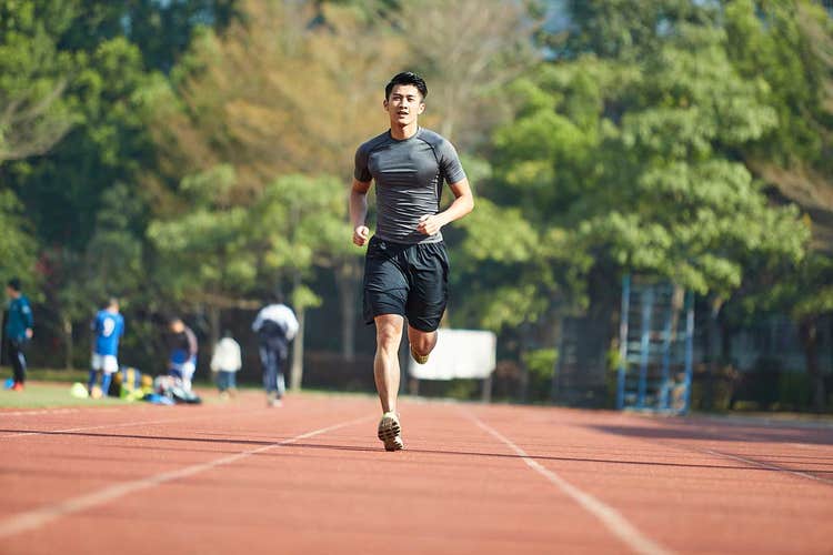 male-running-outside-on-track