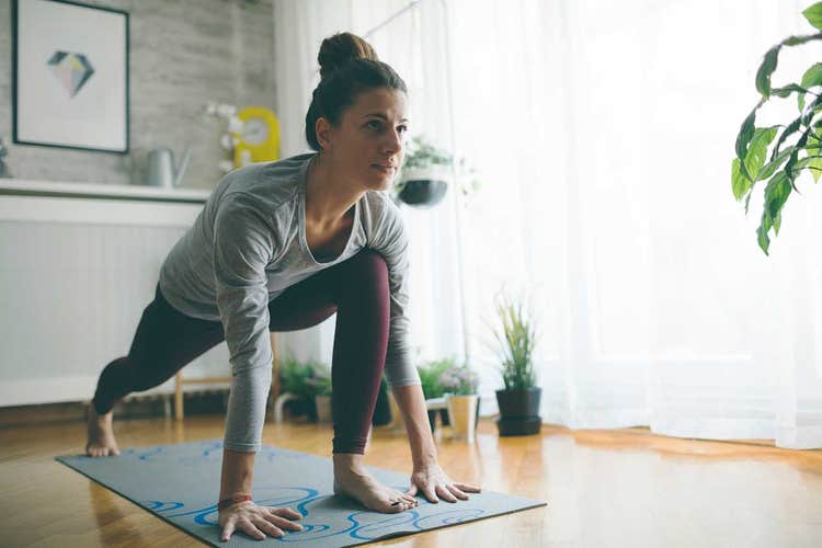woman doing yoga at home