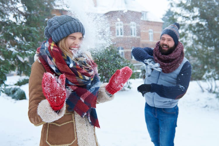two-people-having-fun-in-the-snow