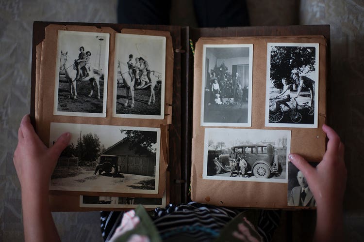someone-looking-through-photo-album