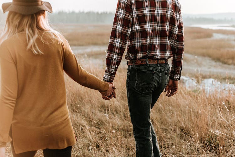 couple-holding-hands-and-walking